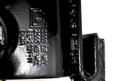 Black powder-coated standard utility slider winch with a 5,500 lbs working load limit, weighing 13 lbs, designed for use with utility trailer channels.